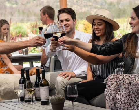 group enjoying bottles on the patio